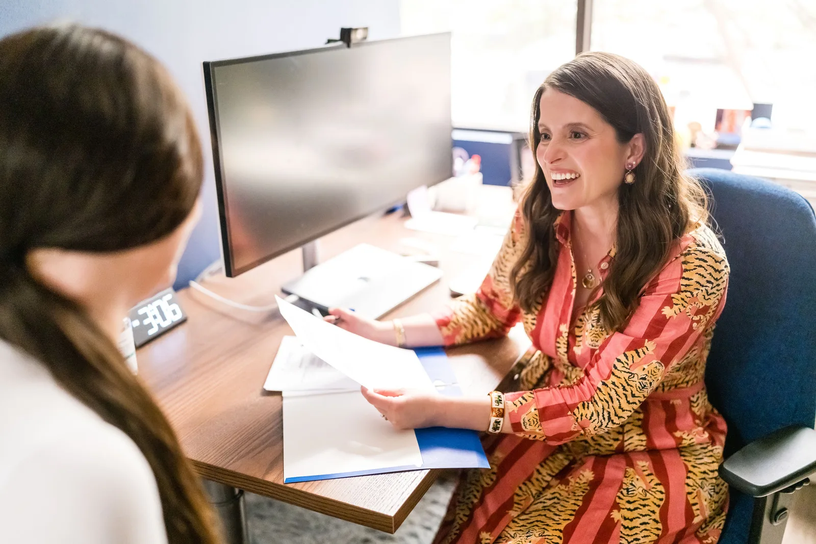 Dr. Stephanie Vertrees listening to a patient during a visit